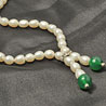 Alluring White Pearls with Green Onyx